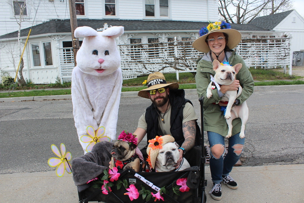 Rescue dogs Luna, Marigold, and Kilo wear their hats with pet parents Aubrey McRedmond and Cody Milne.